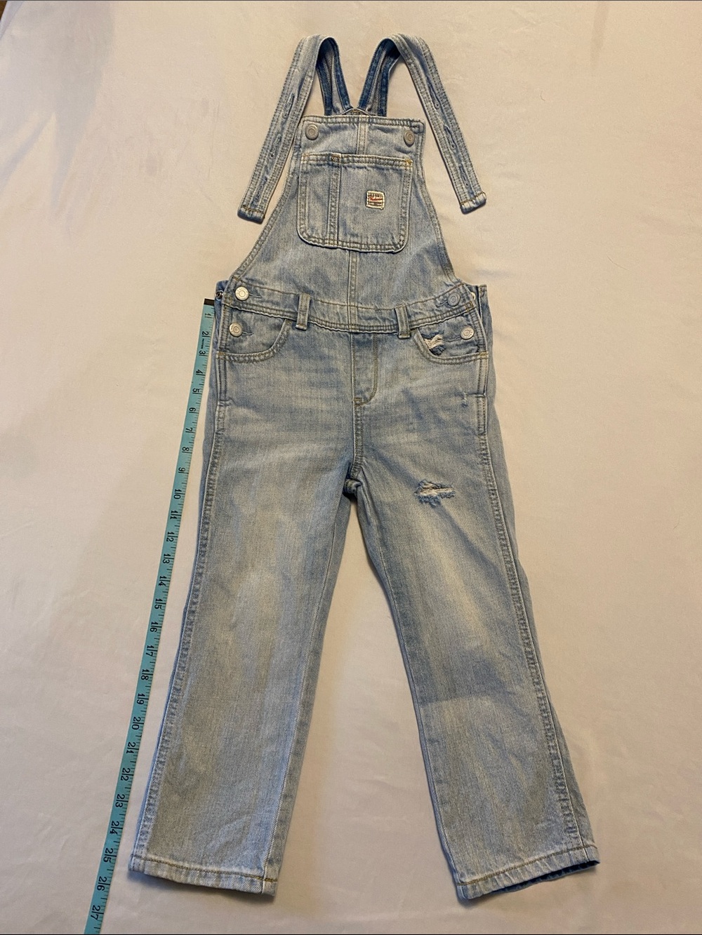 Old Navy Light Wash Kids Denim Overalls with Adjustable Straps and side snaps.